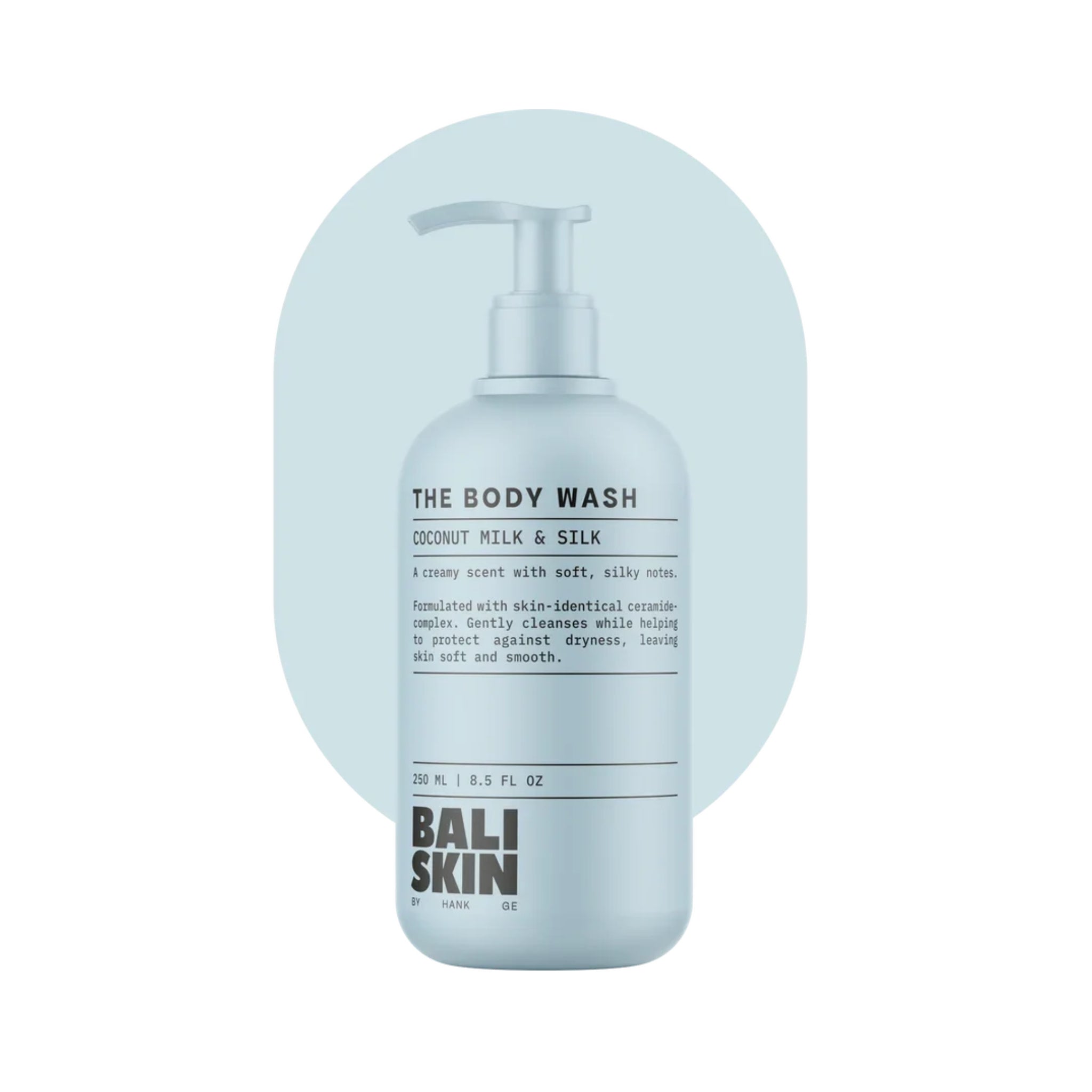 Bali Skin The Body Wash pumpeflaske med Coconut Milk & Silk duft, 250 ml, lyseblå baggrund.
