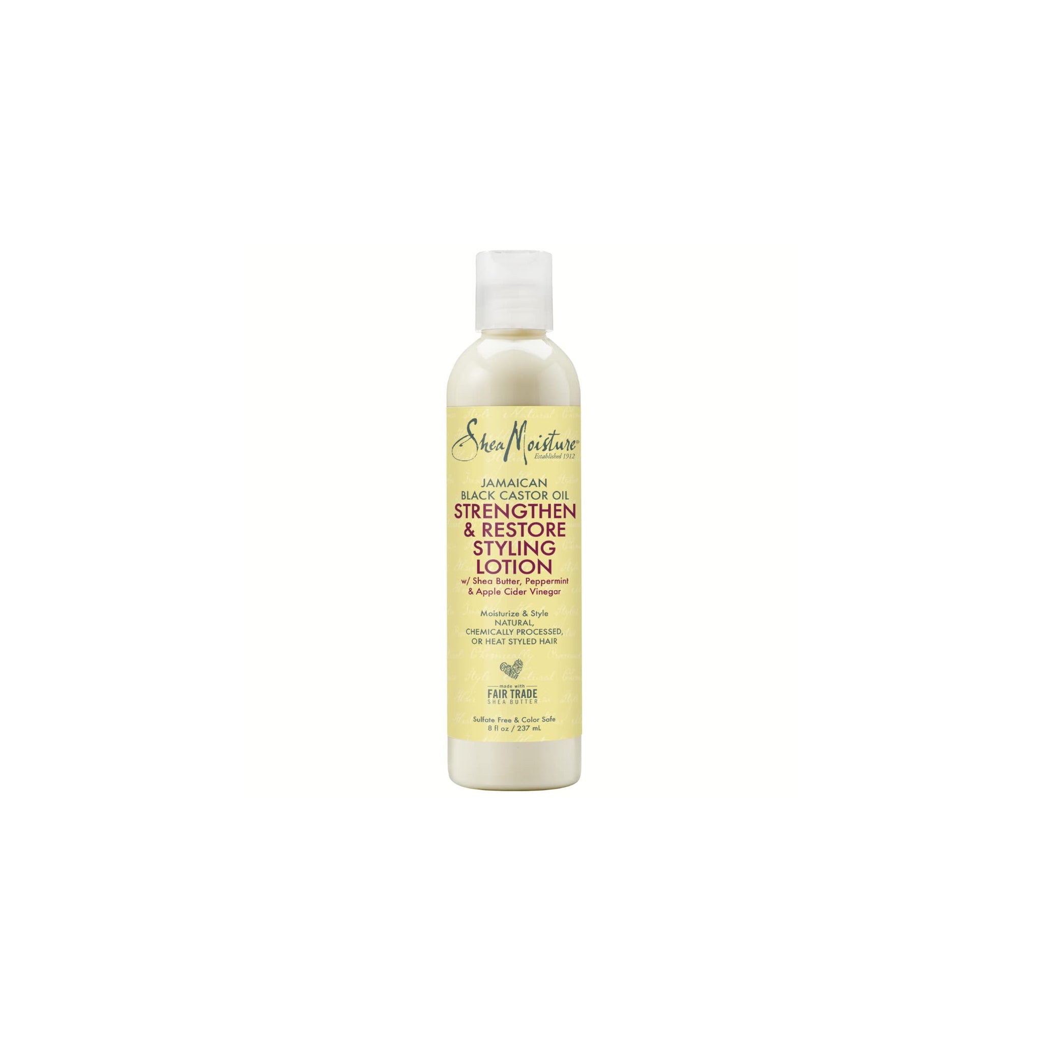 Hvid flaske med hvidt låg indeholdende Shea Moisture Jamaican Black Castor Oil Strengthen & Restore Styling Lotion. Etiketten er beige/gul med sort og rød tekst.
