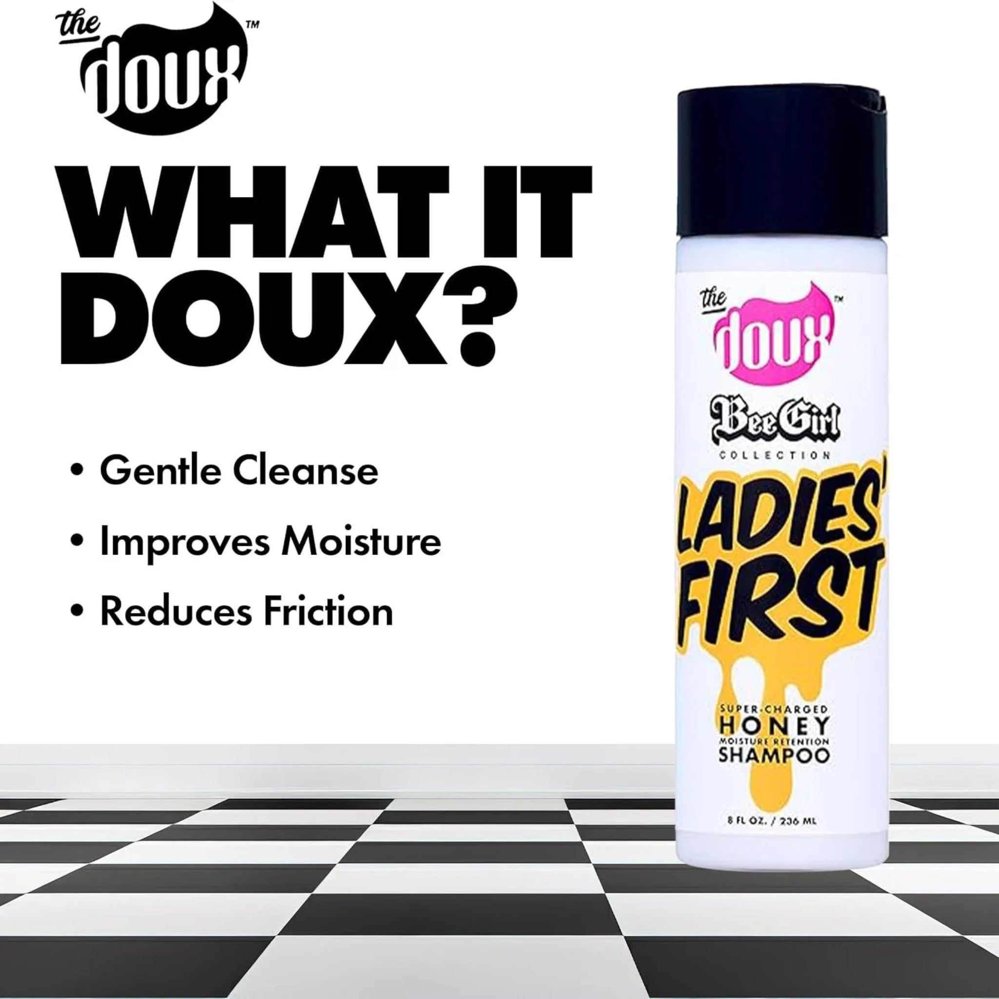 The Doux Bee Girl Ladies' First honningshampoo-flaske med sort låg på skakternet gulv, tekst om fugtgivende hårpleje.